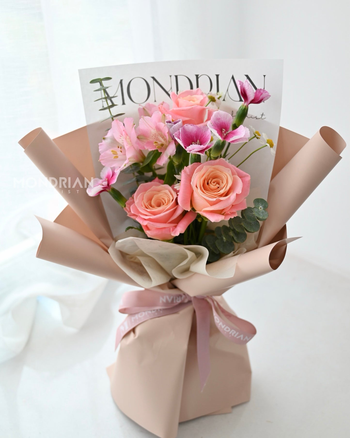 a simple bouquet with fresh roses and filler flowers