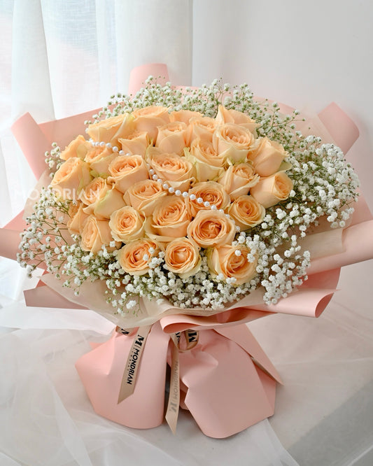 a bouquet of 30 stalks of fresh champagne rose and white baby's breath by Mondrian Florist SG