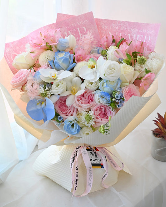 a luxury fresh flower bouquet with white orchids, pink and blue roses