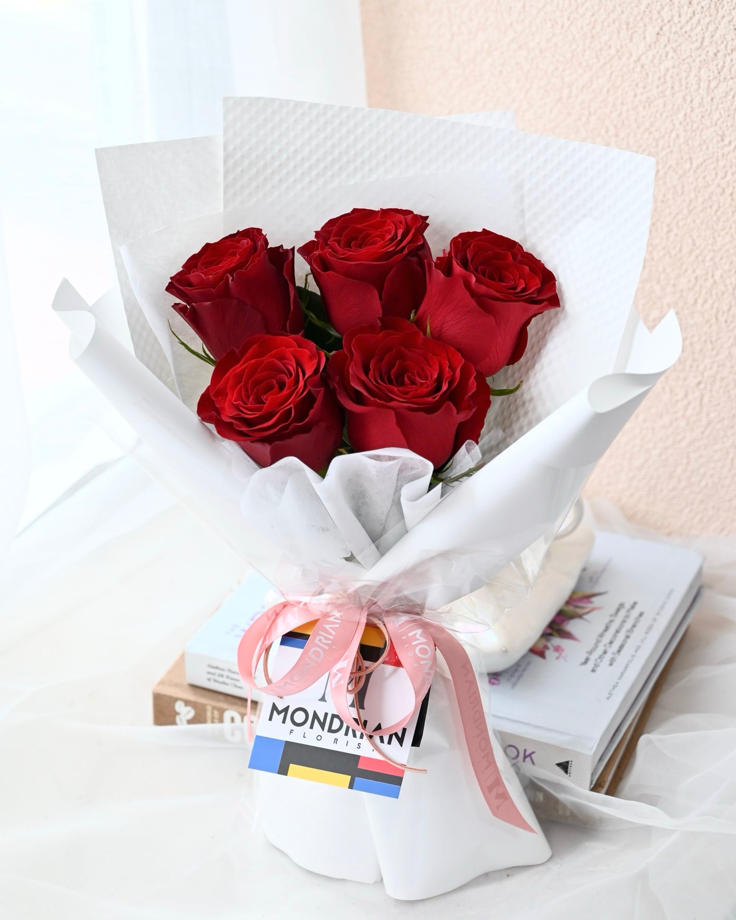 a bouquet of pure red roses by Mondrian Florist
