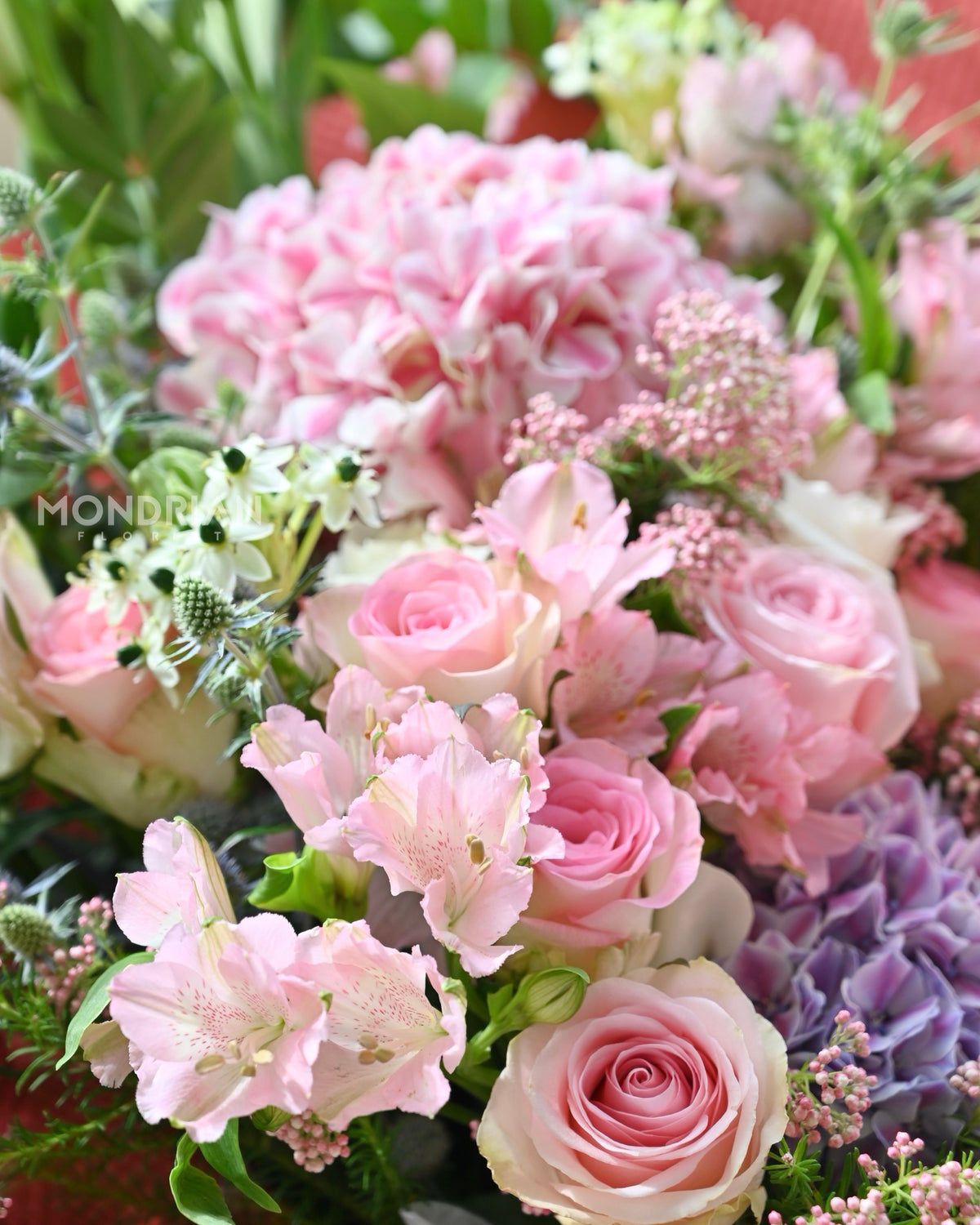 close up of a luxury pink hydrangea and rose fresh flower bouquet by Mondrian Florist