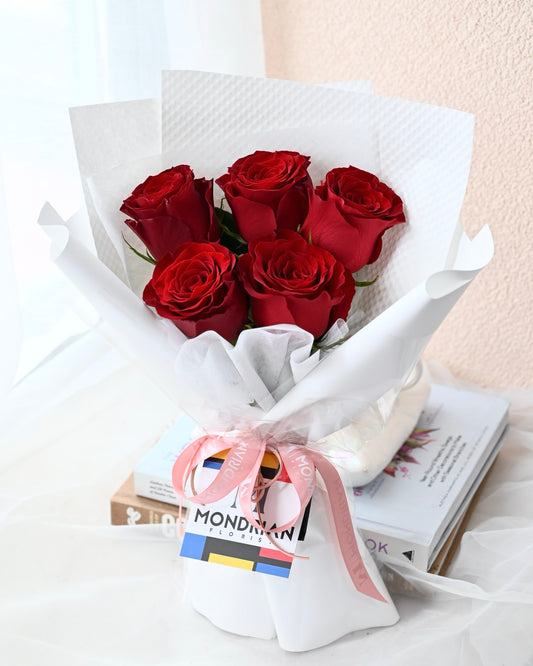 a bouquet of pure red roses by Mondrian Florist