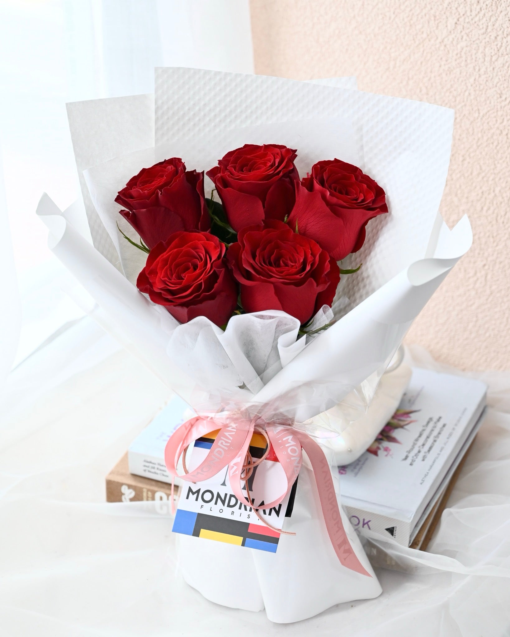 a bouquet of pure red roses by Mondrian Florist