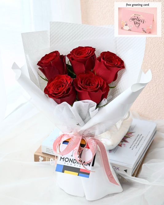 a bouquet of pure red roses by Mondrian Florist