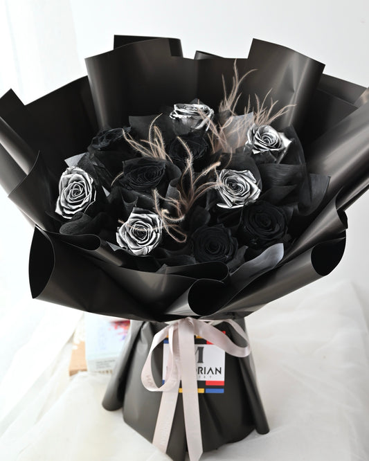 a bouquet with preserved black and silver roses
