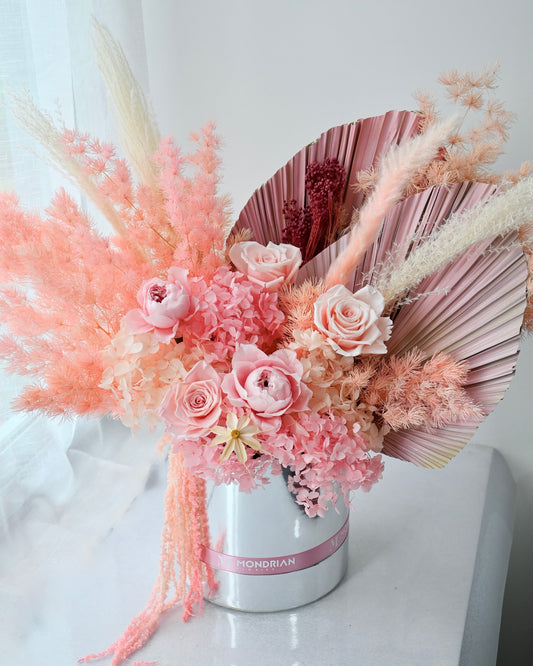 a preserved and dried flower box in pink and coral color