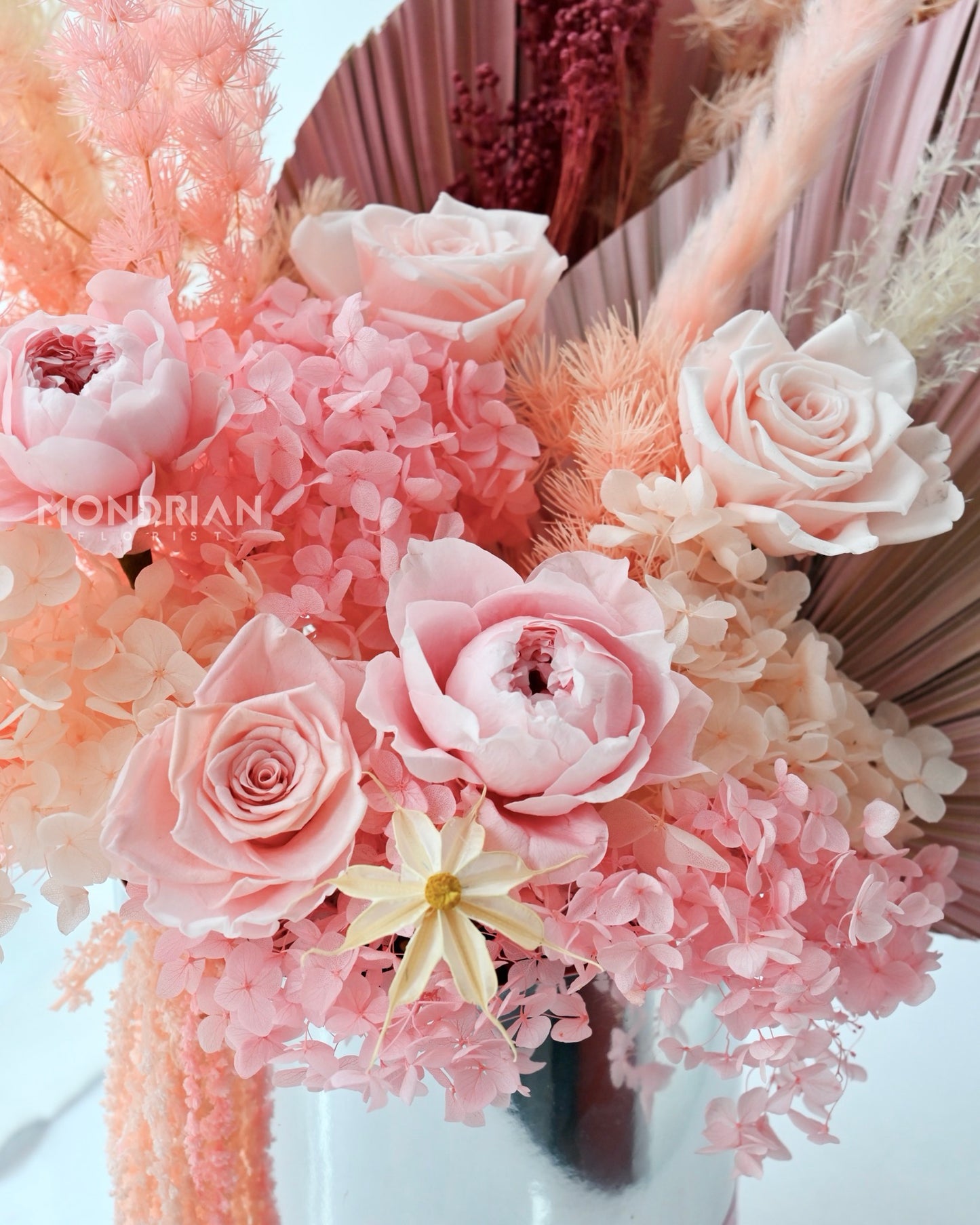 close up of a preserved and dried flower box in pink and coral color