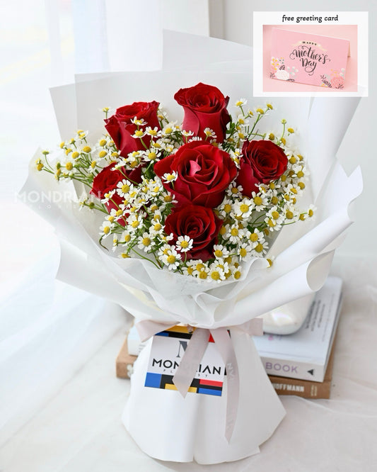 a flower bouquet of red roses and daisy flower by Mondrian Florist