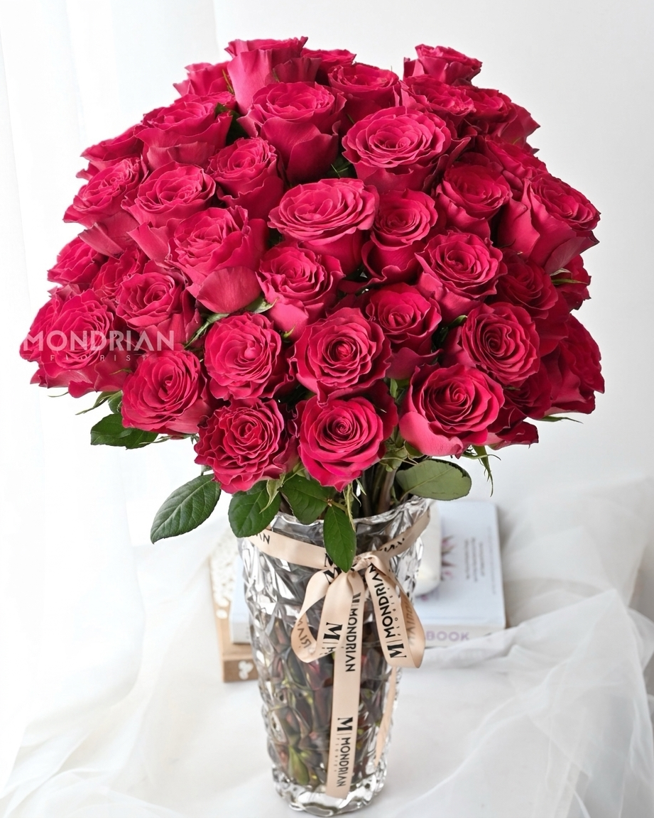 50 stalks hot pink roses in clear glass tall vase